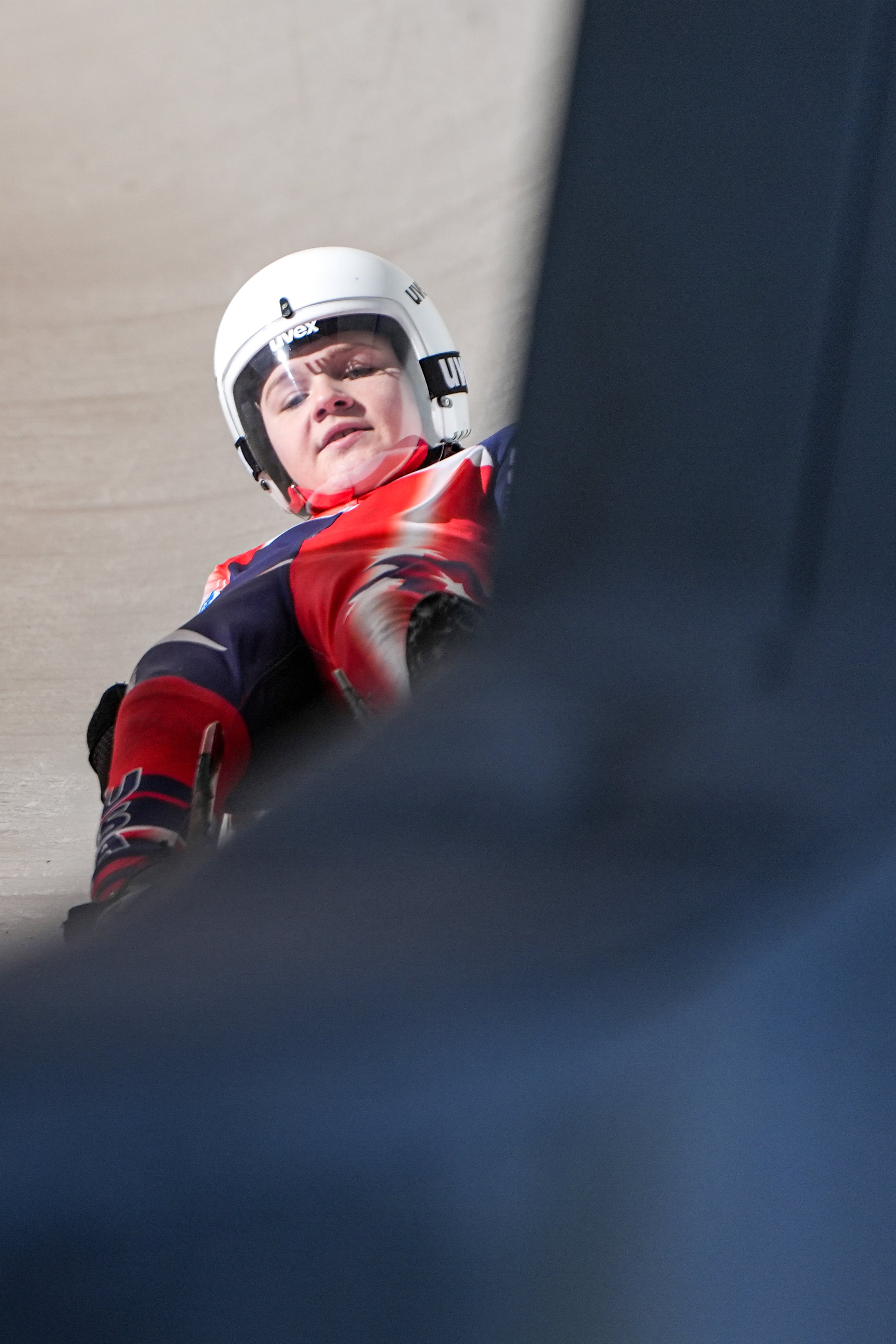 Luge racer slides down the track during the luge races on February 6, 2026 at Mount Van Hoevenberg in Lake Placid, NY. (Isaac Williams/The Newhouse School)