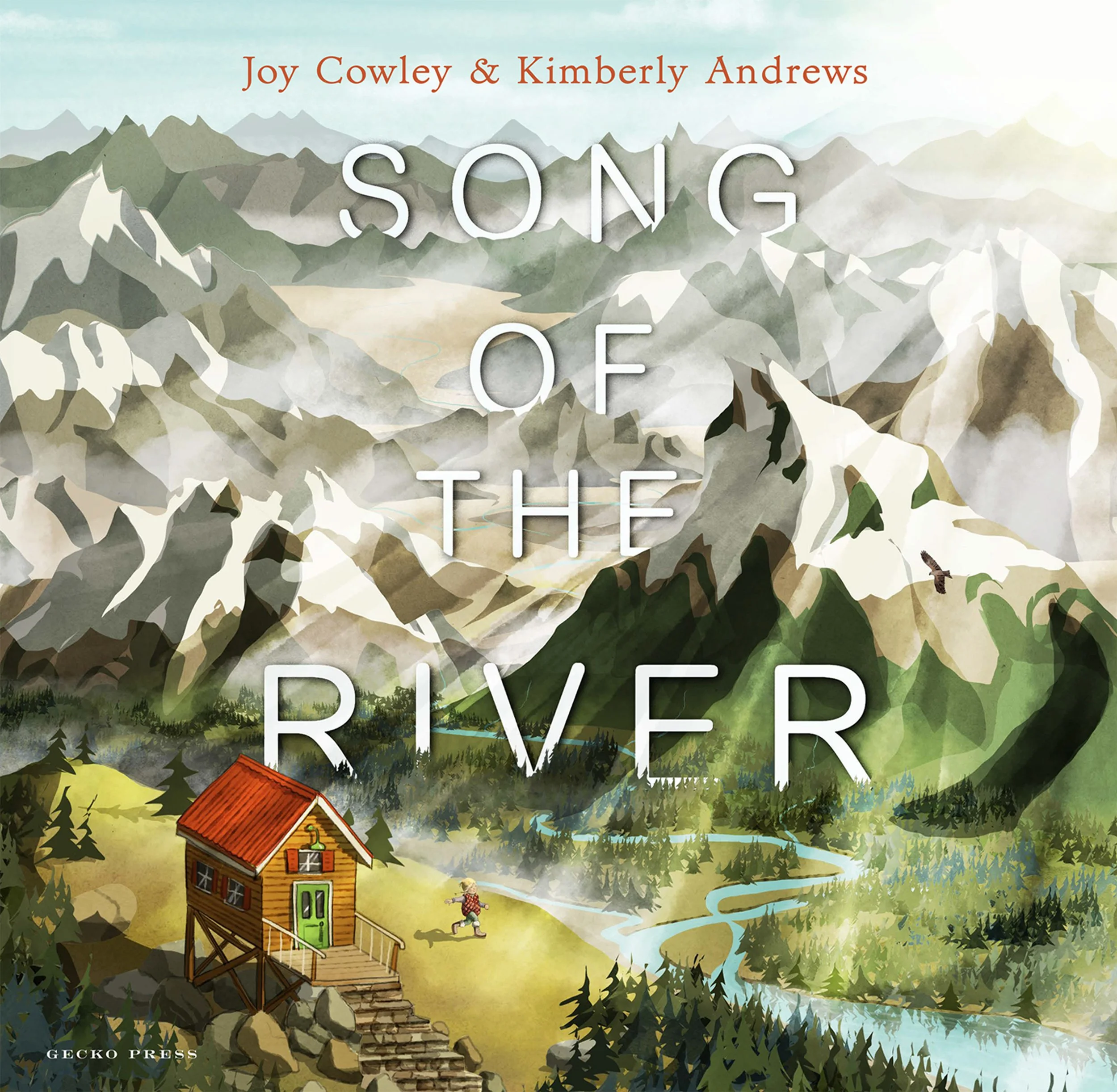 Book cover titled 'Song of the River' by Joy Cowley and Kimberly Andrews featuring a mountainous landscape with snow-capped peaks, a river winding through green forests, a small wooden cabin with a red roof and a child playing outside.
