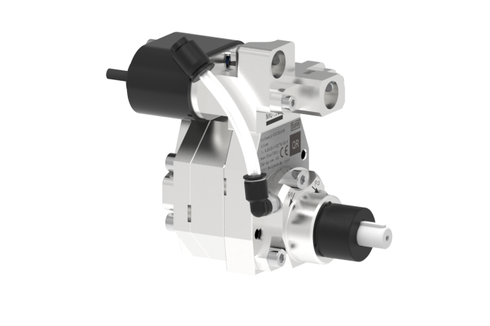 A close-up of a medical laser device used in ophthalmology, showing components like lenses, tubing, and adjustment dials.