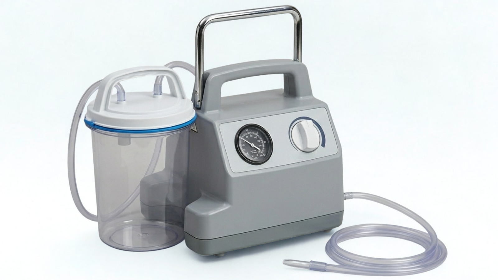 A gray portable suction machine with a gauge, a control knob, and a clear collection canister with hoses attached.