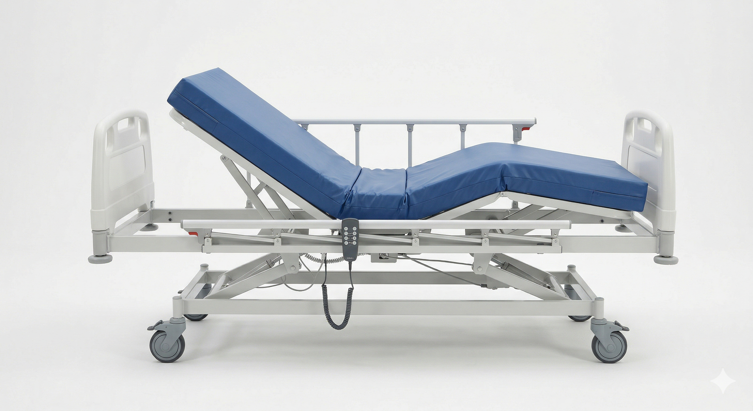 Hospital bed with adjustable side rails, a blue mattress, and wheels for mobility, set against a plain white background.