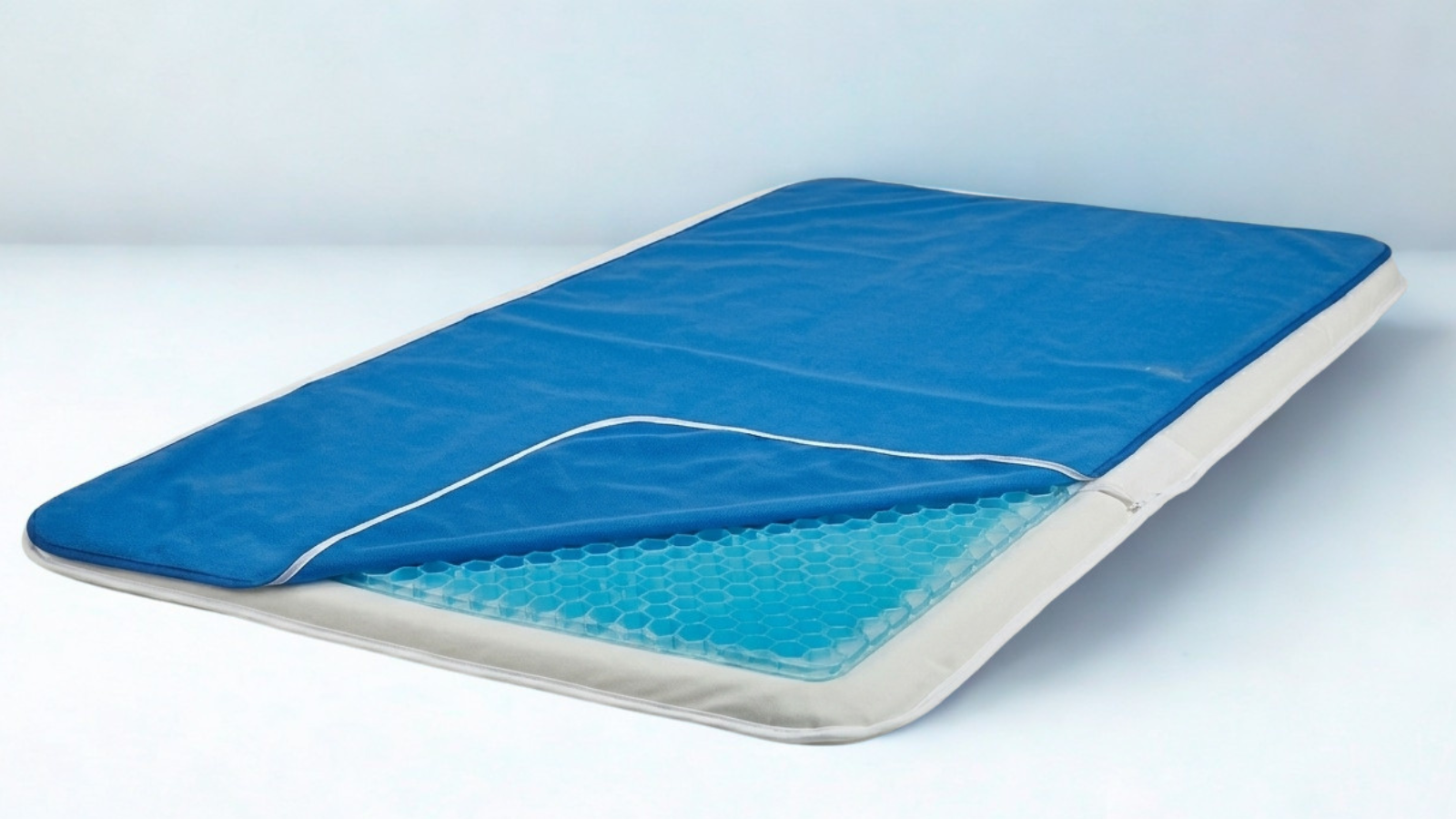 Memory foam mattress with cooling gel layer and a blue cooling gel pad on top