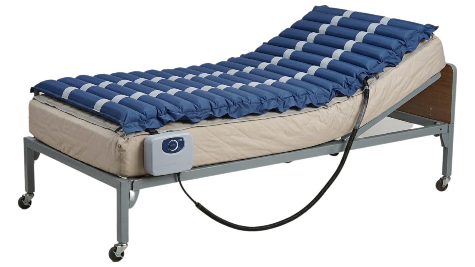 Hospital bed with an alternating pressure mattress overlay and a control unit attached.