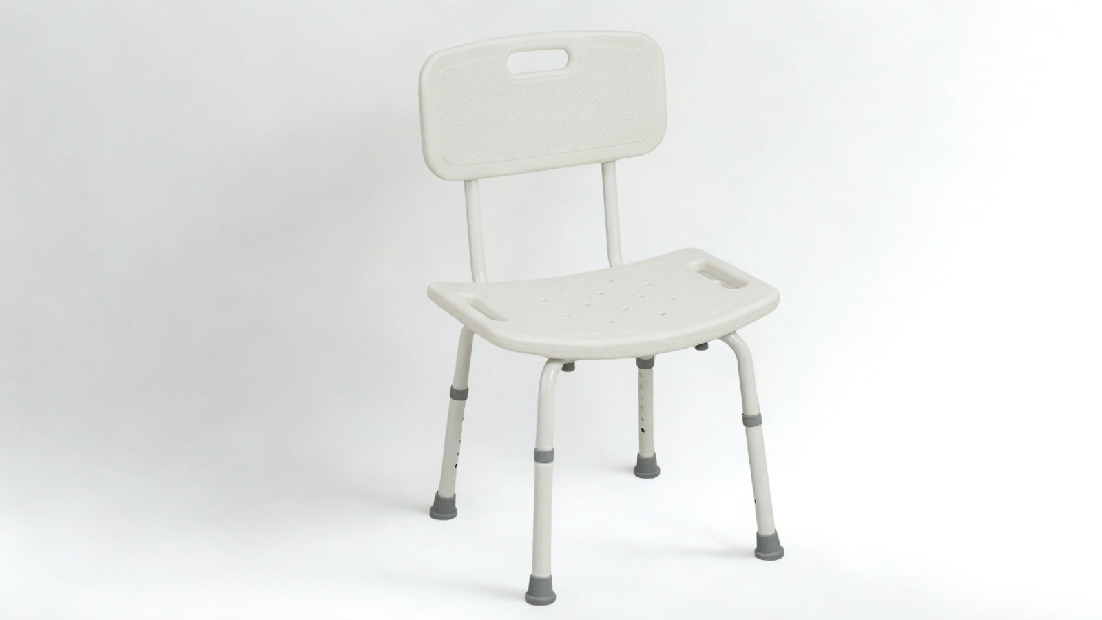 White shower chair with backrest and adjustable legs on a plain white background.