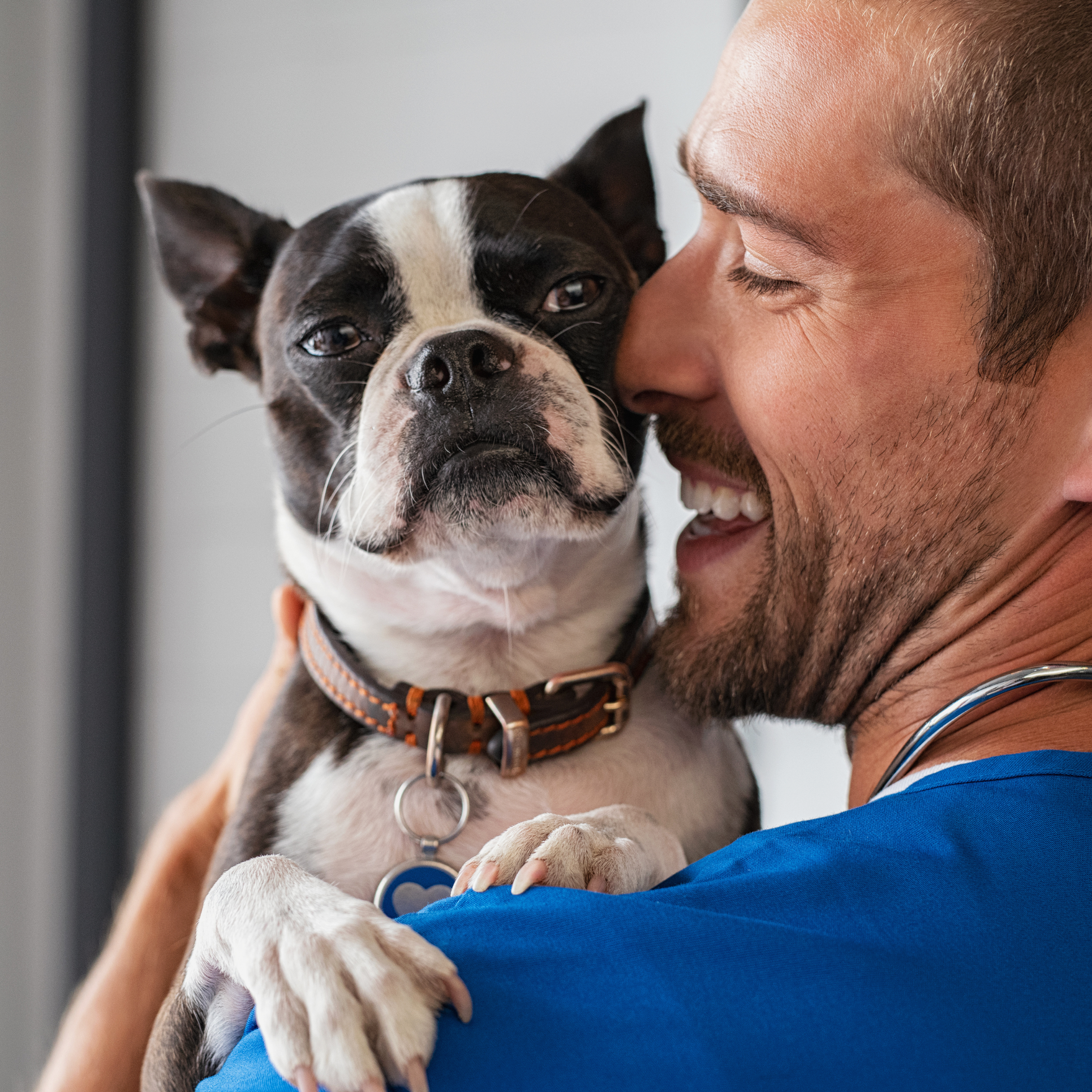 Man cuddling with his dog