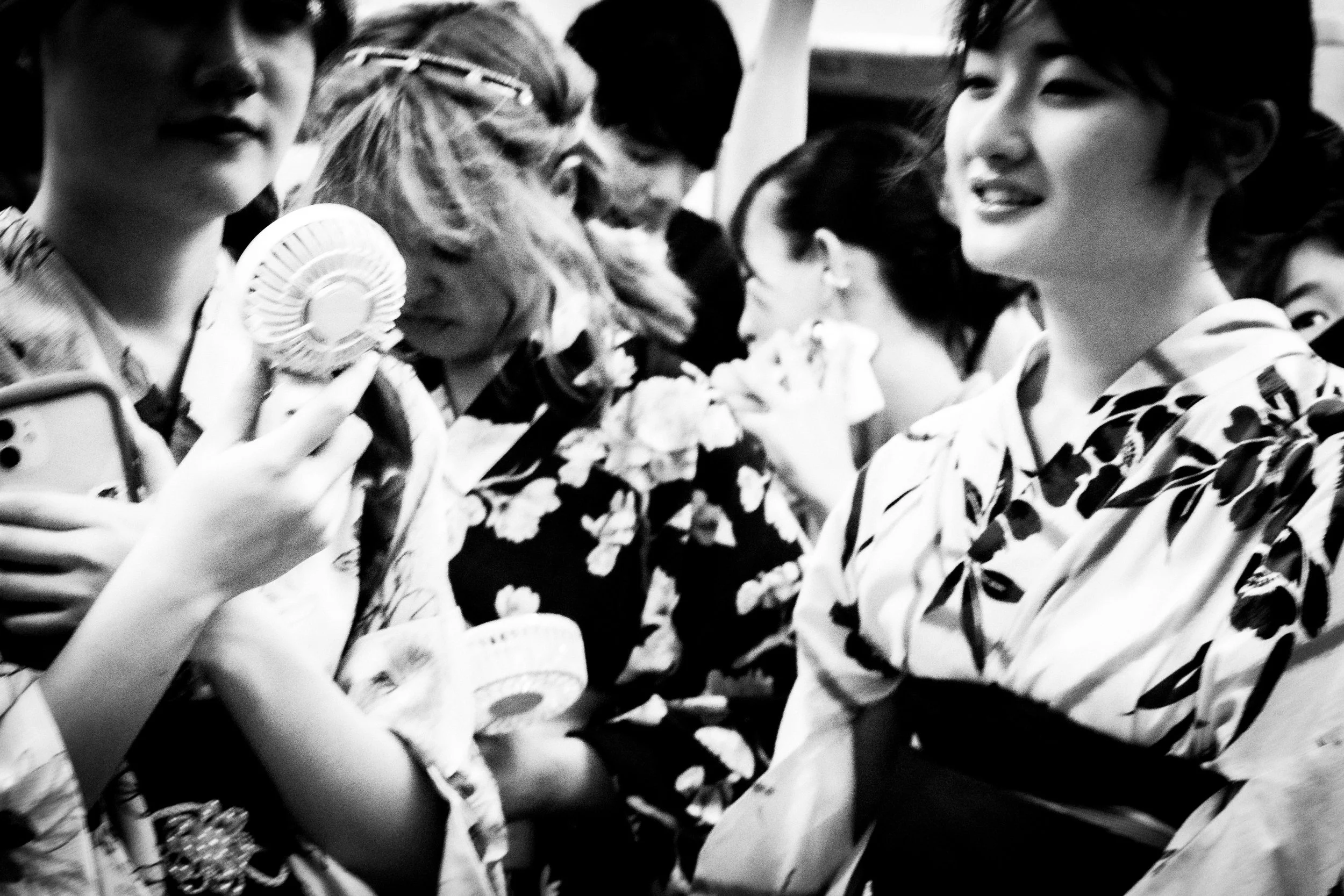 Three young women in yukata during a summer moment in Japan. From the series “Urban Contrasts: Flow and Solitude in Contemporary Japan” — Michel Soares, 2026.