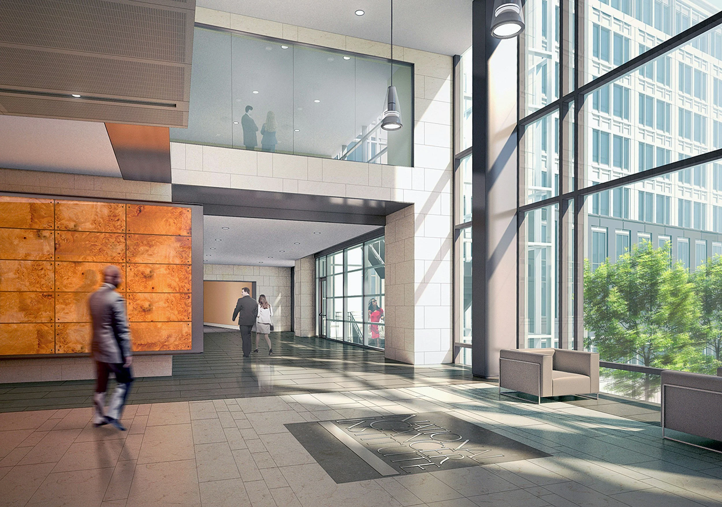 Modern office building lobby with large glass windows, people walking, and interior seating area.