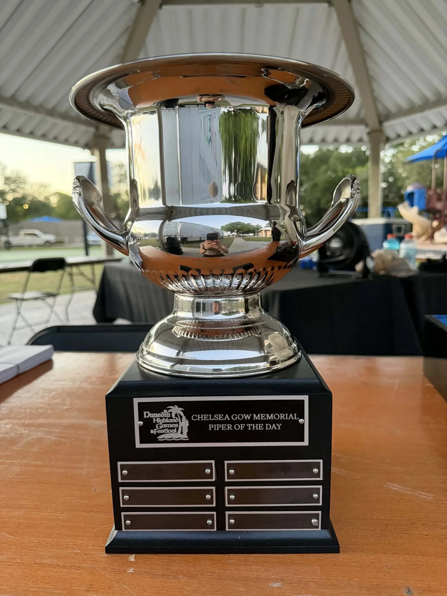 As of April 2026, the Chelsea Gow memorial Piper of the day trophy will be awarded annually to an outstanding bag piper at the Highland games festival in Dunedin, FL. Our sponsorship of this trophy benefits the Scottish Arts. 