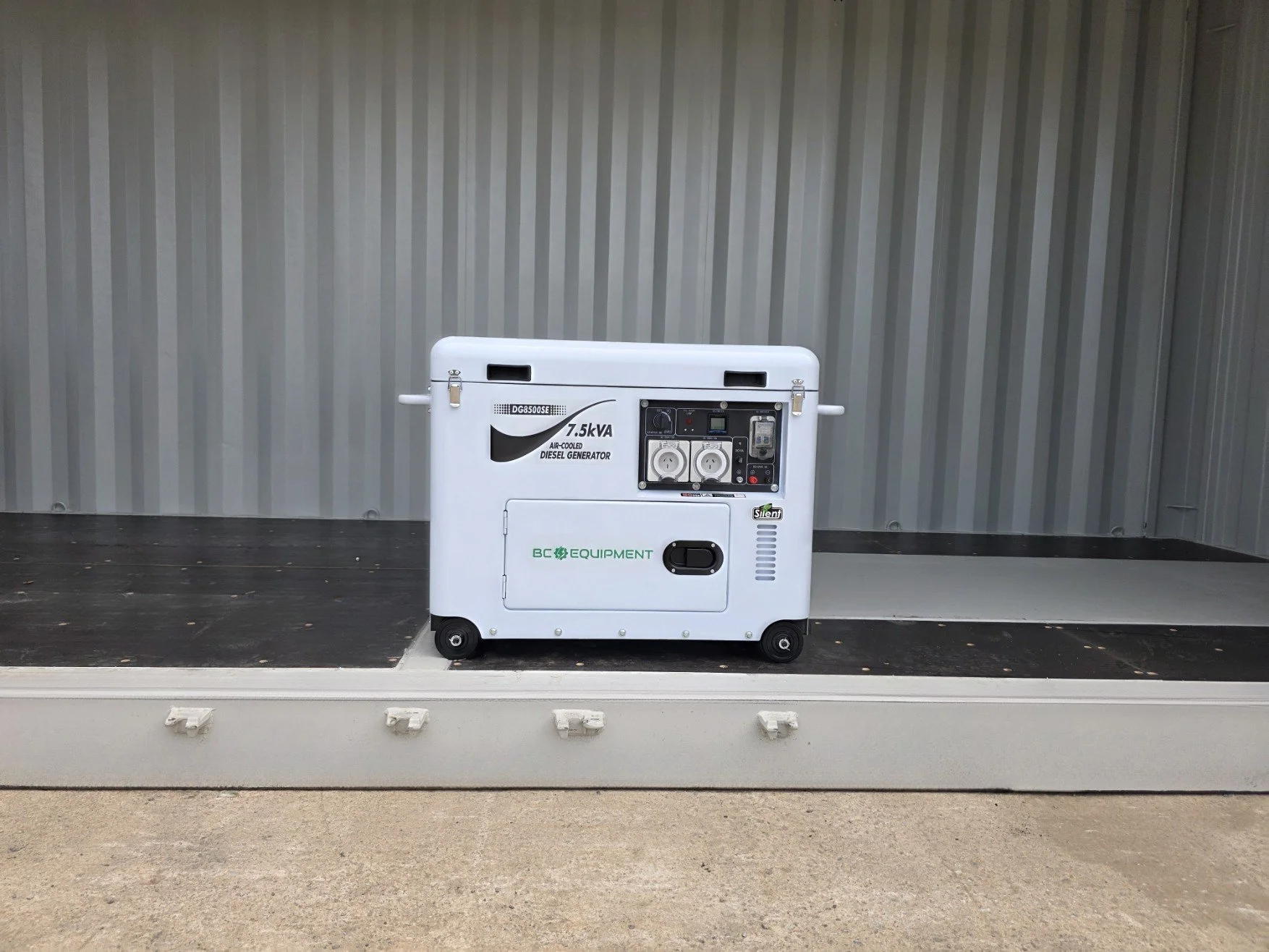 White 7.5 kVA air-cooled diesel generator on wheels inside a cargo container