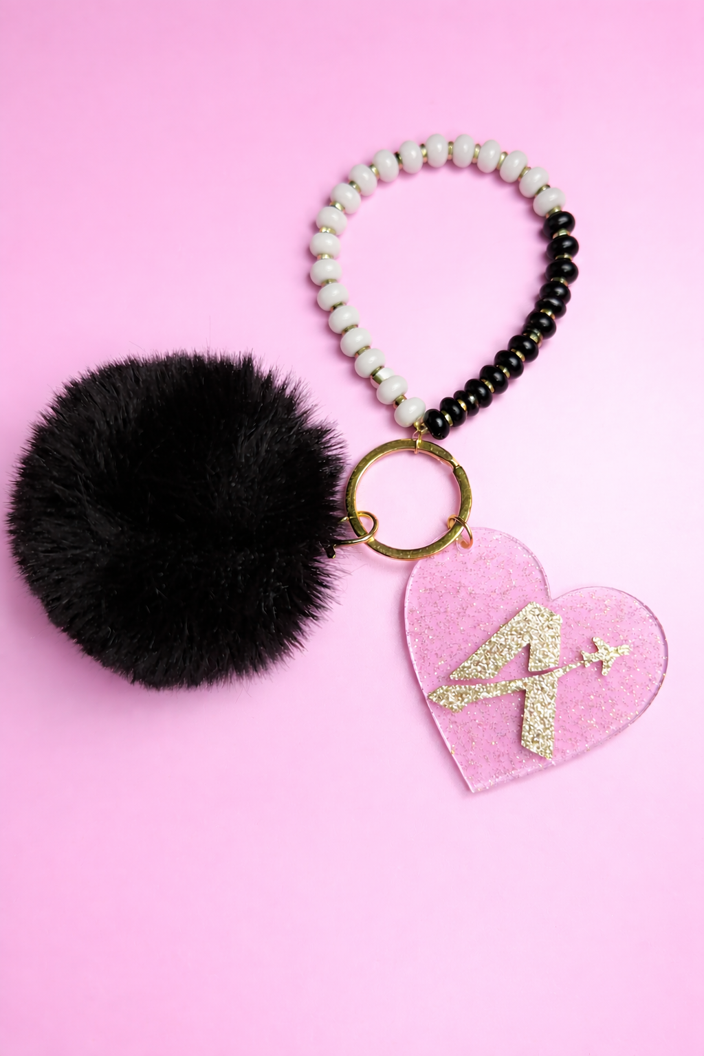 Fluffy pom-pom keychain with glittery heart.png