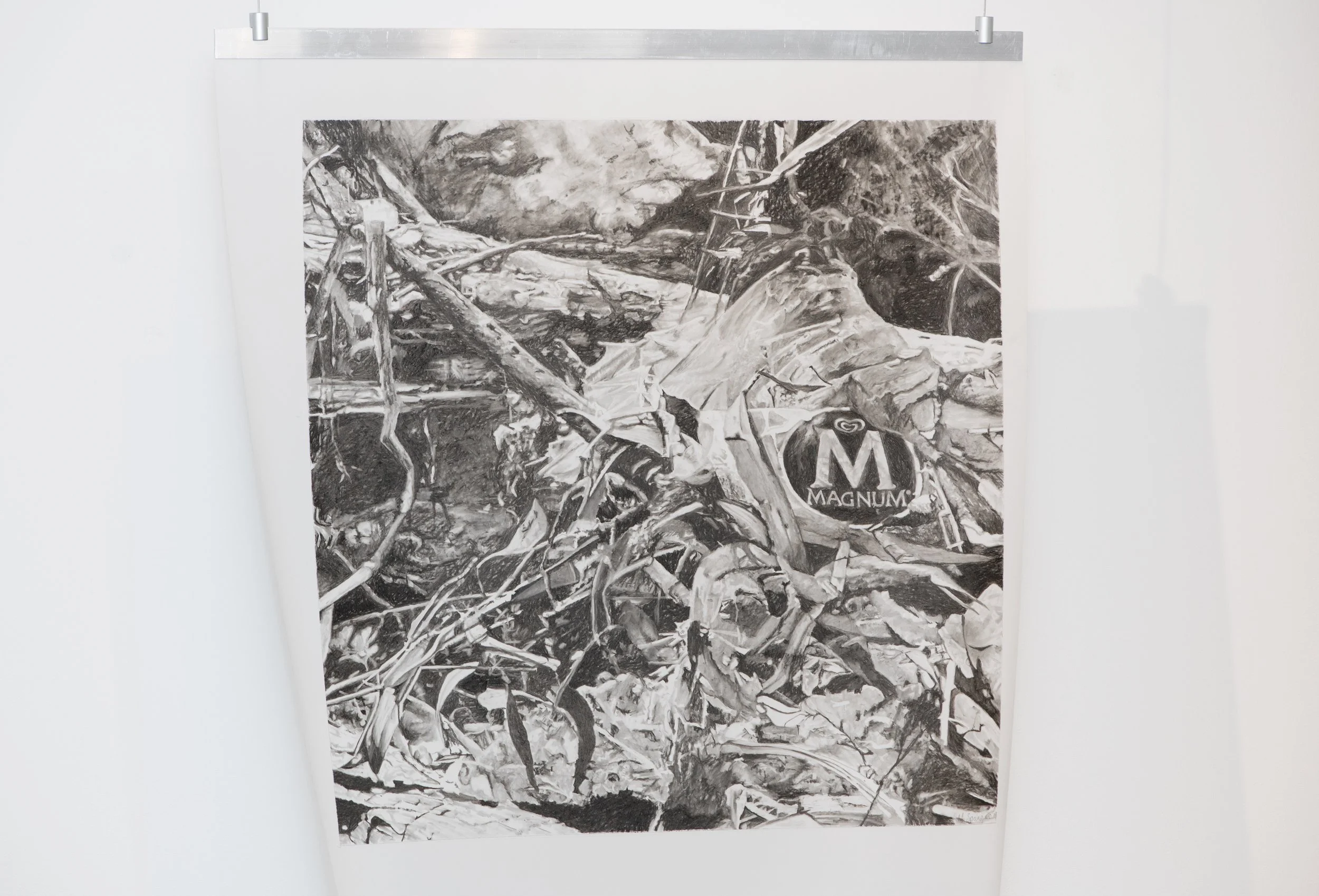 Black and white drawing depicting various tangled tree branches and litter with a Magnum logo at the bottom right corner.