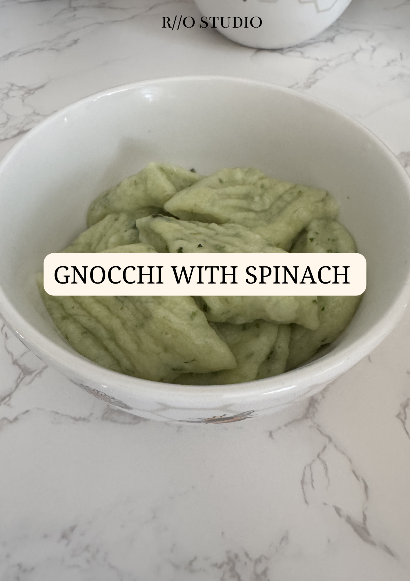 Gnocchi with spinach, potatoes, and mozarella cheese served with a drizzle of butter 