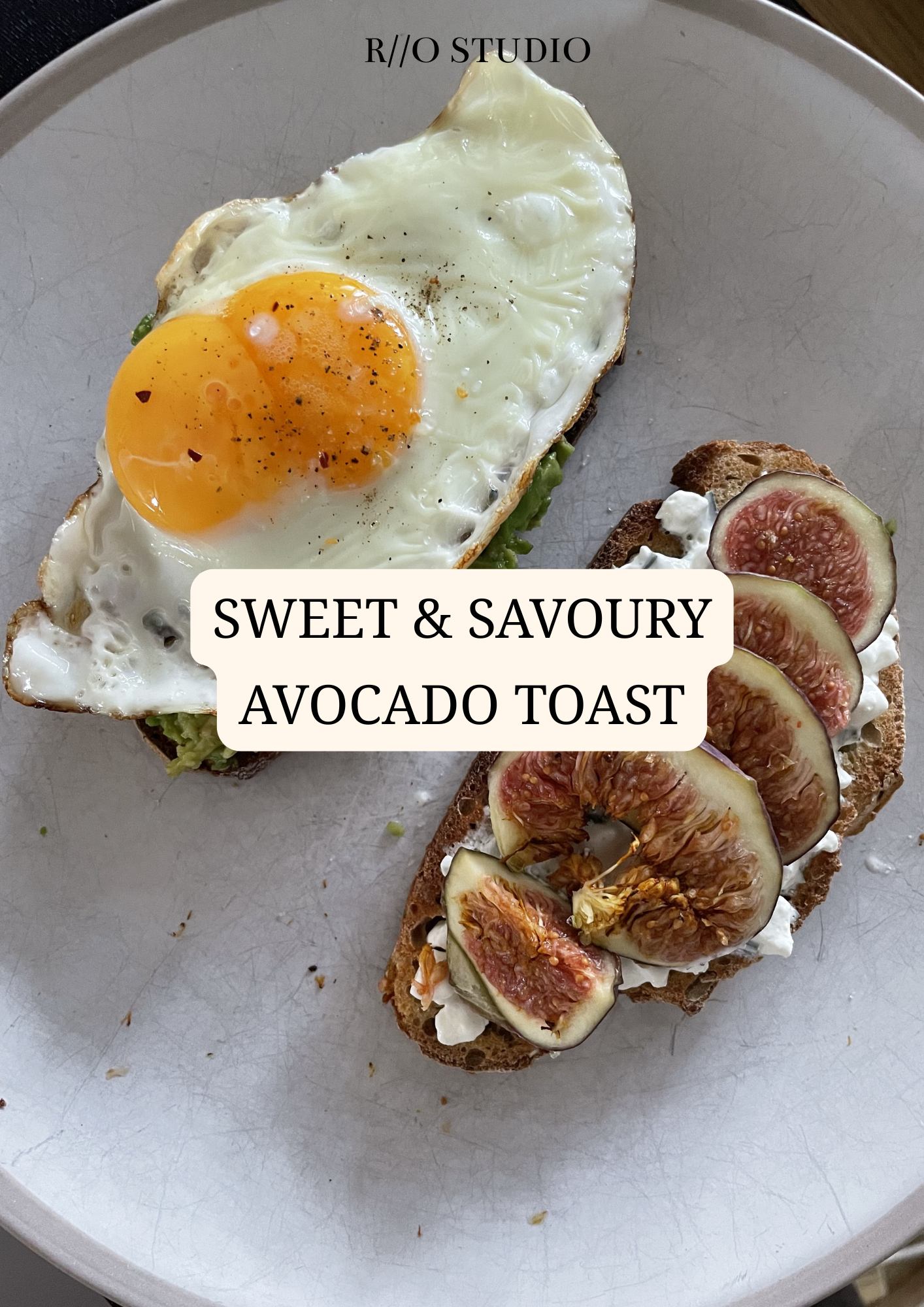 A plate with a fried egg on avocado toast and a fig-topped toast with cream cheese, garnished with black pepper and fresh figs.