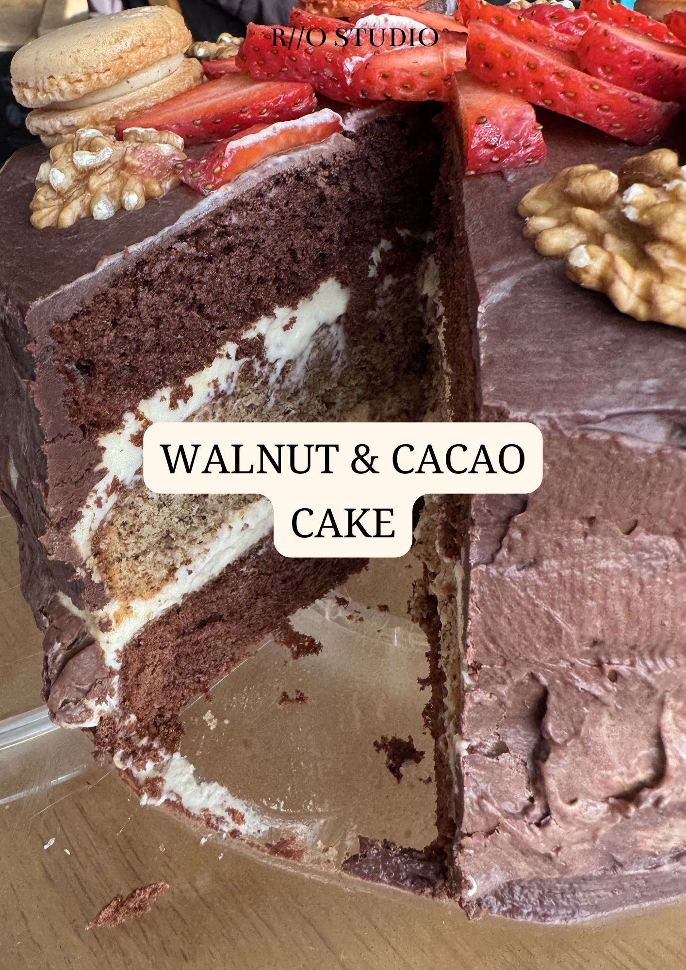 A walnut and cacao cake with a dark chocolate ganache flavour frosting 