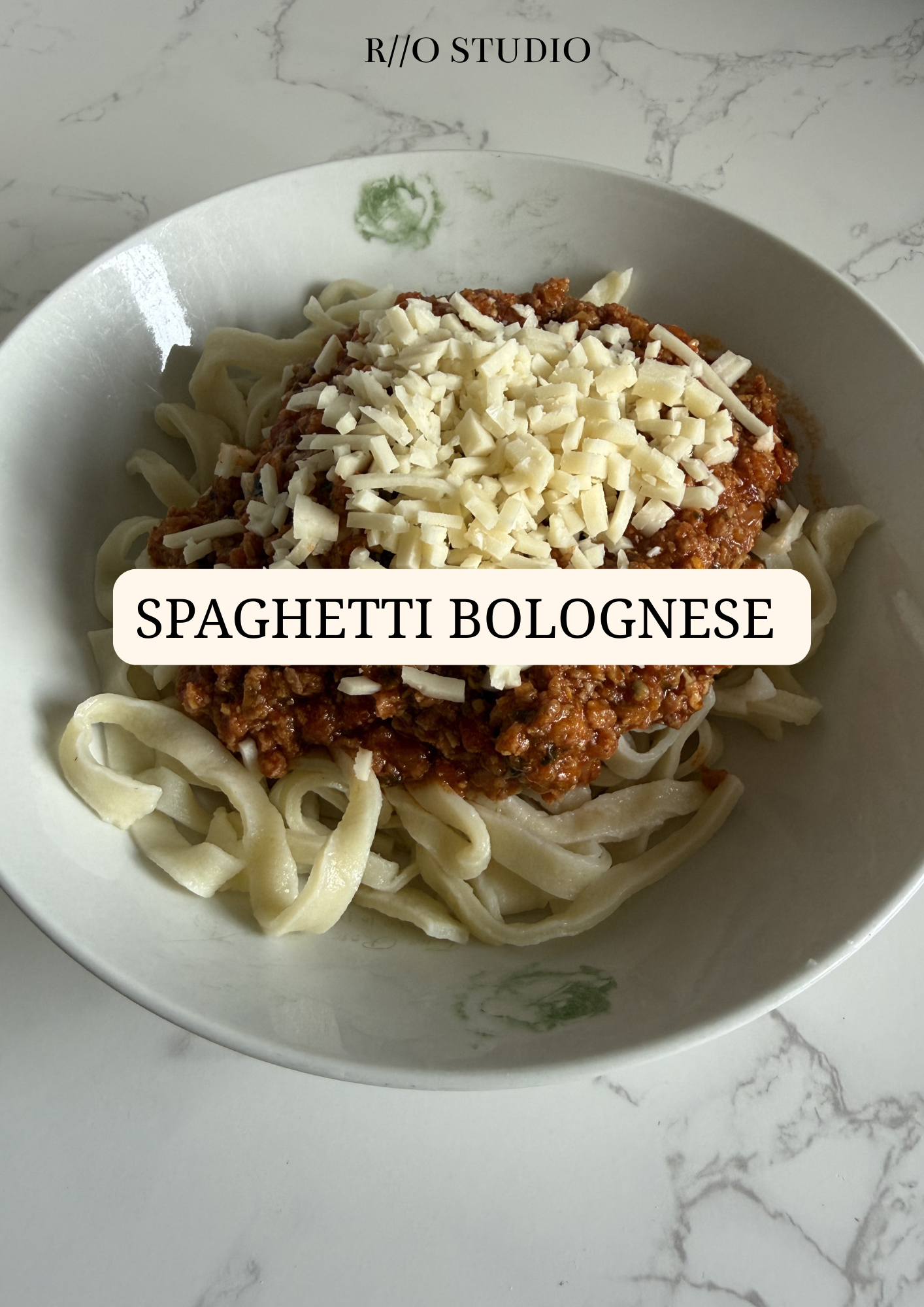 Spaghetti bolognese with sprinkled parmesan, a rich bolognese source and homemade pasta