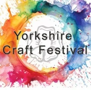 Colorful watercolor splash background with the text 'Yorkshire Craft Festival' in the center.