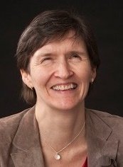 NADSN | National Association of Disabled Staff Networks | Professor Anna Lawson Smilin at the Camera With a Dark Background