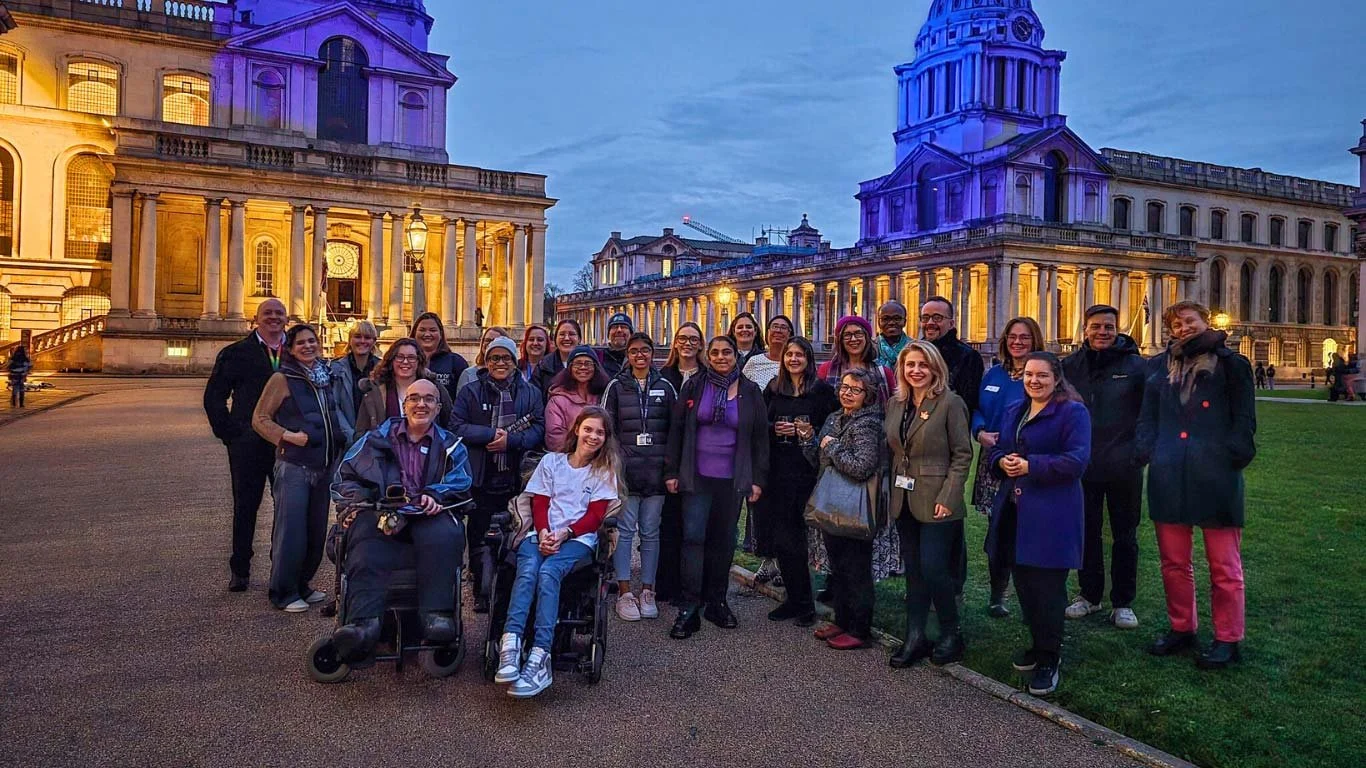 NADSN | National Association of Disabled Staff Networks | A Group of People, Including Two Wheelchair Users, Standing Together Outside