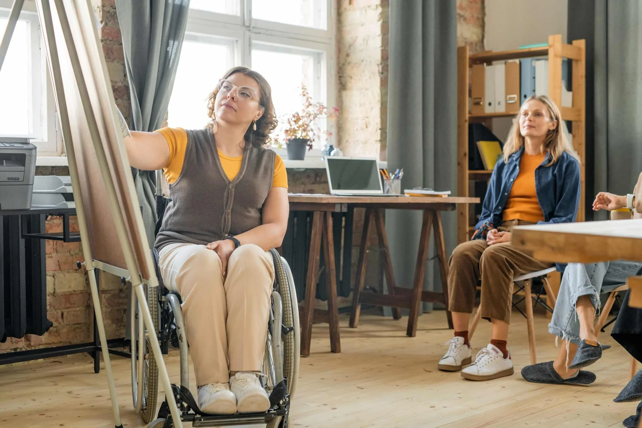 NADSN | National Association of Disabled Staff Networks | Woman in a Wheelchair Painting on a Canvas