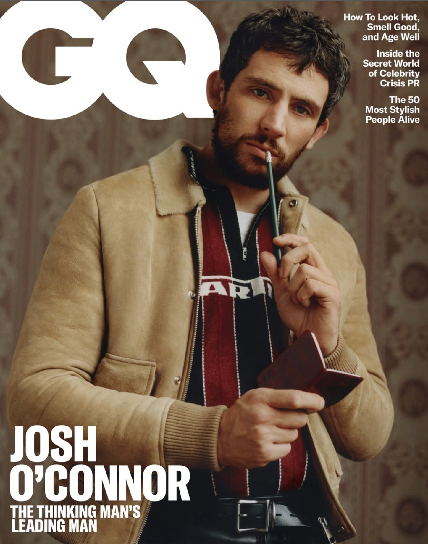 Magazine cover featuring a man with dark hair and a beard, wearing a tan jacket and holding a pen to his lip. The cover includes headlines about celebrity topics and features Josh O'Connor as a subject.