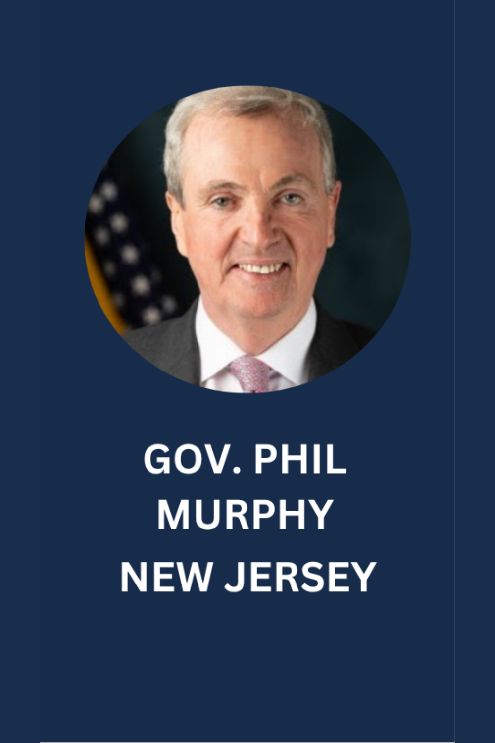 Portrait of Governor Phil Murphy of New Jersey, smiling, wearing a suit and tie, with the American flag in the background.