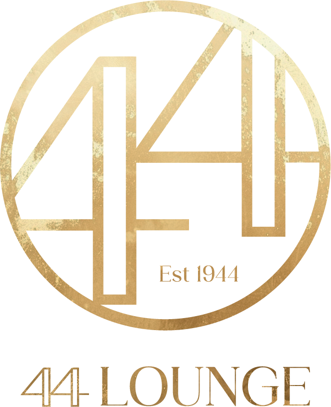 A gold-colored circular emblem with a stylized musical note and the word 'MUSIC' underneath.