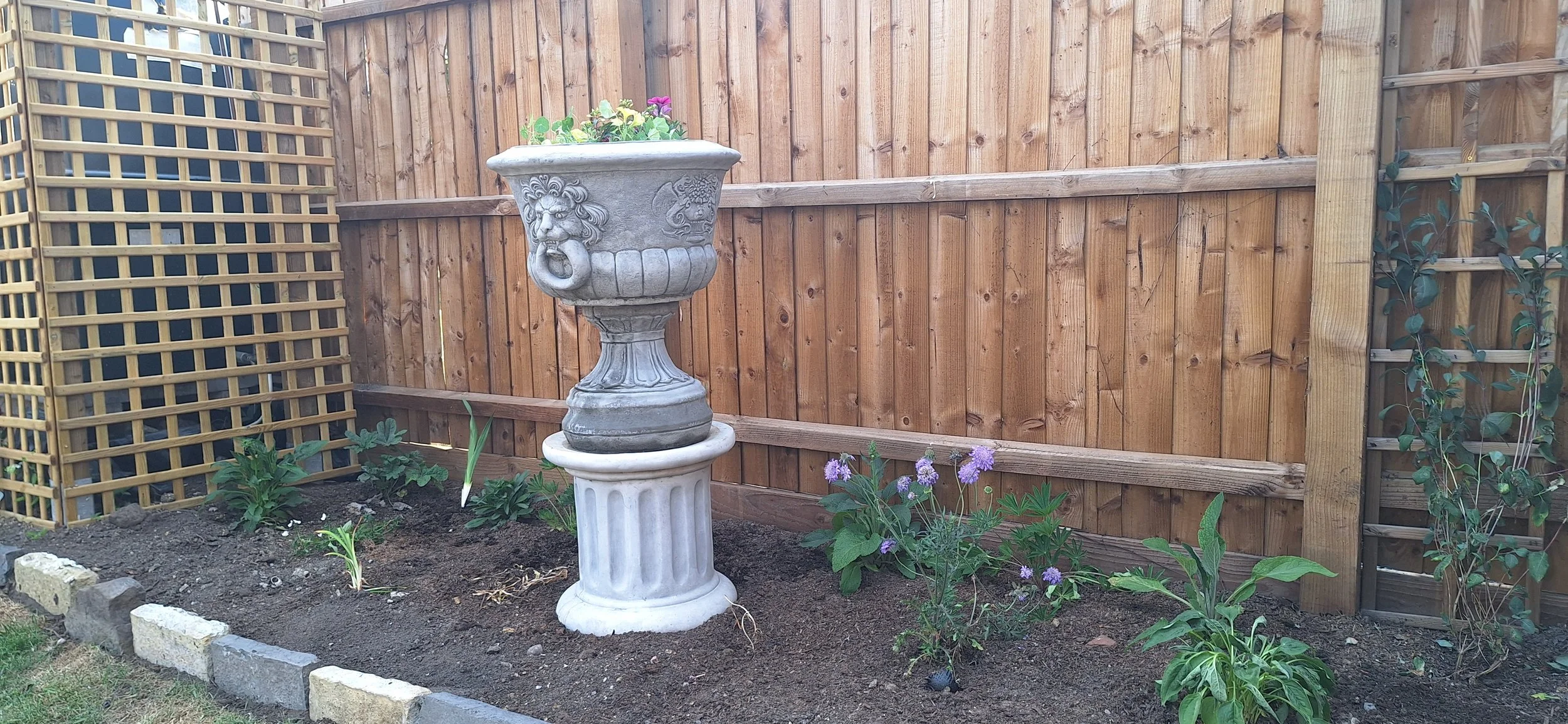 Installing a border in a cottage garden.