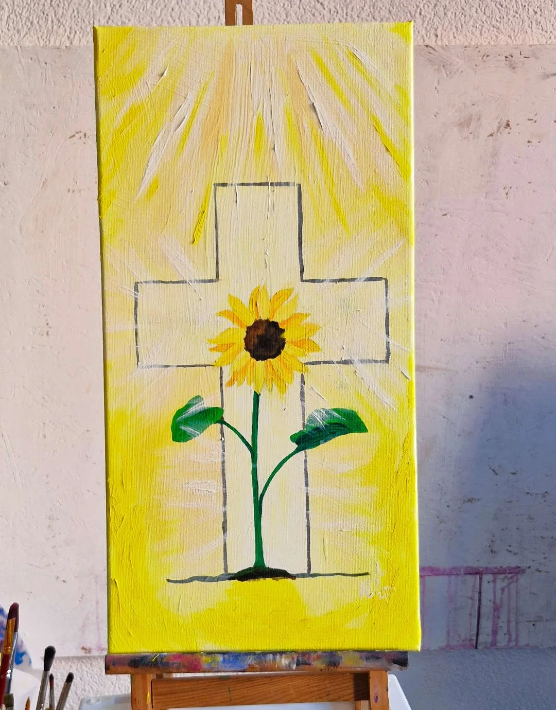 Kunstwerk, inspiriert durch den Bibelvers Epheser 1,3 - Eine Sonnenblume steht vor einem hell leuchtendem Kreuz, die ganze Umgebung leuchtet und von oben kommt ein helles Licht herab