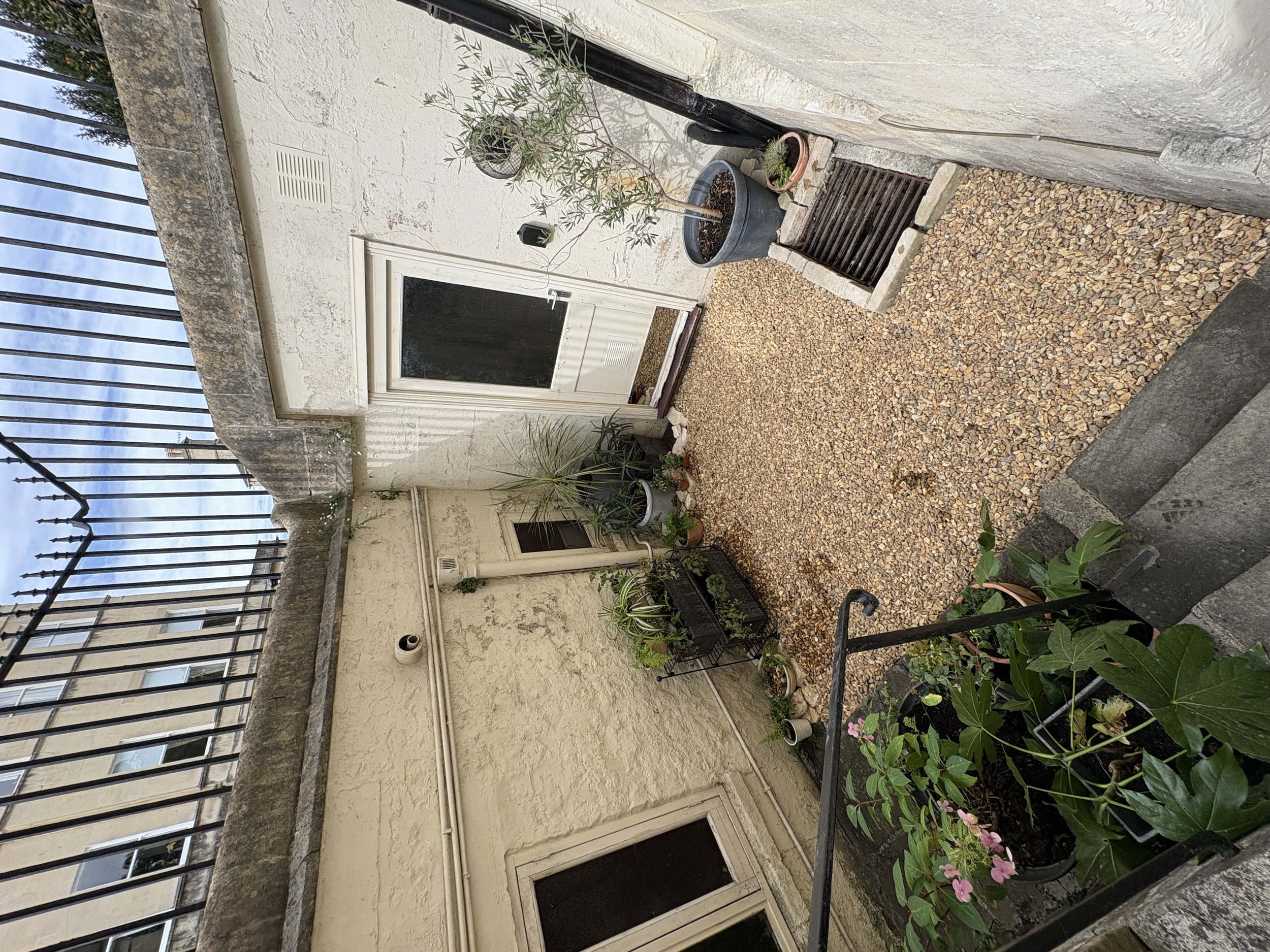 After: Side courtyard. Plants to grow and fill out spaces