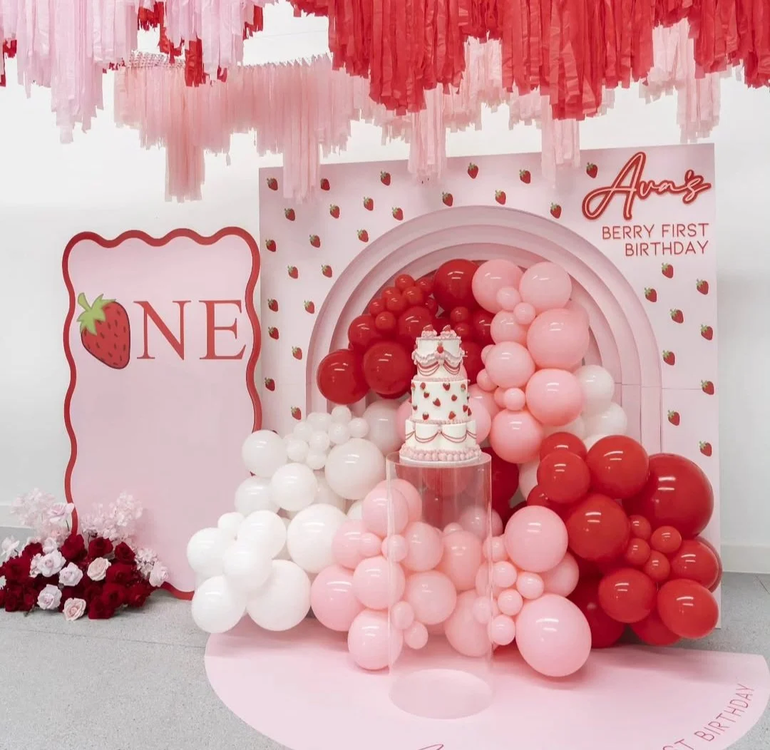 Pink and red balloon display for a first birthday party.  balloon styling melbourne.  melbourne balloon garlands.  balloons melbourne.  backdrops melbourne