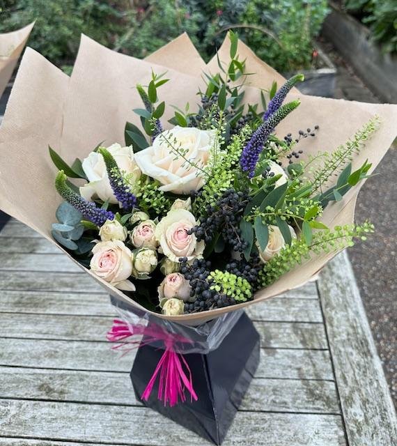 Handtied gift bouquet with pink Roses, purple Veronica in a gift box
