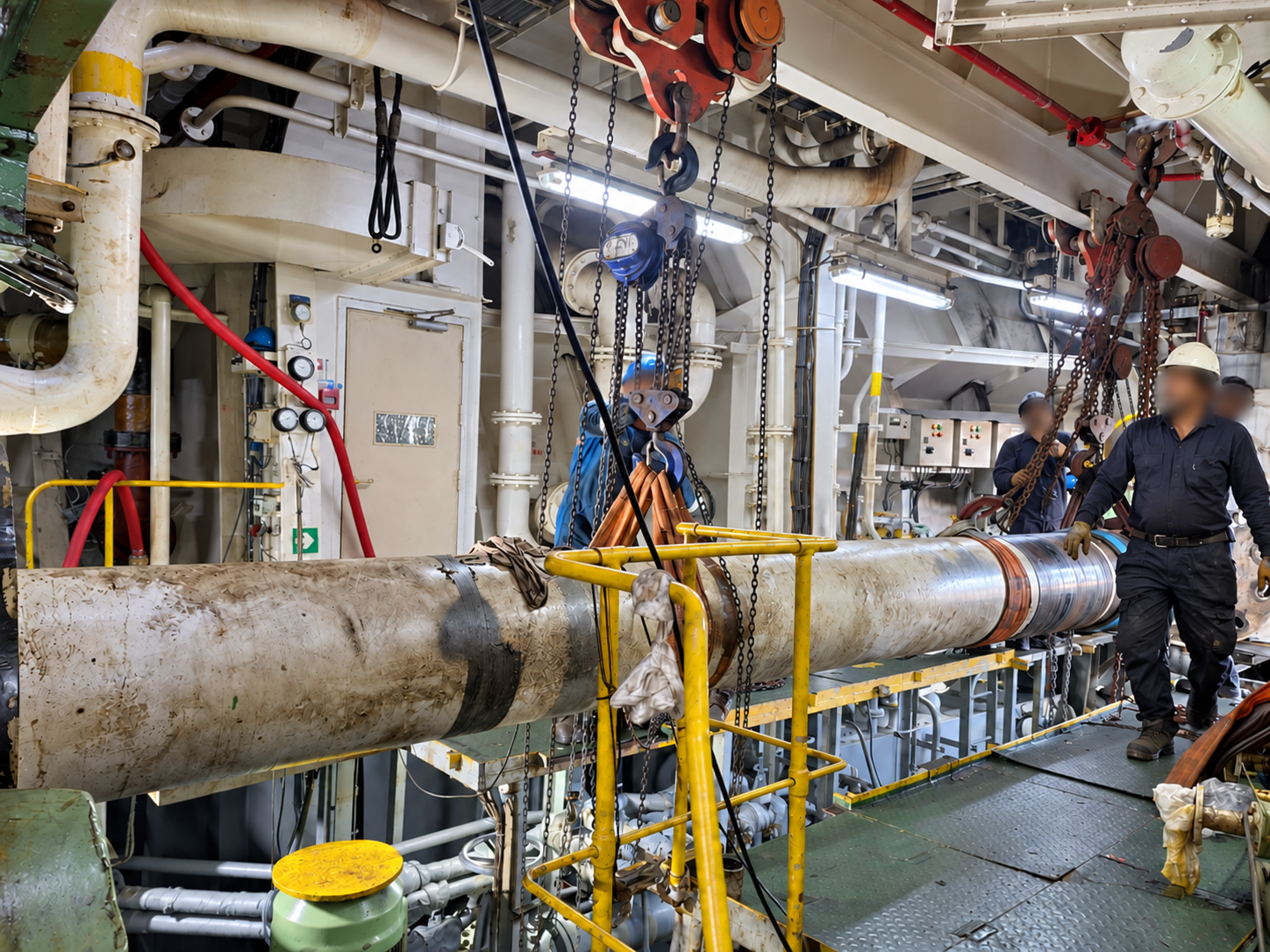 Intermediate propulsion shaft supported by lifting equipment during removal and repair operations as part of a Hull and Machinery damage investigation.