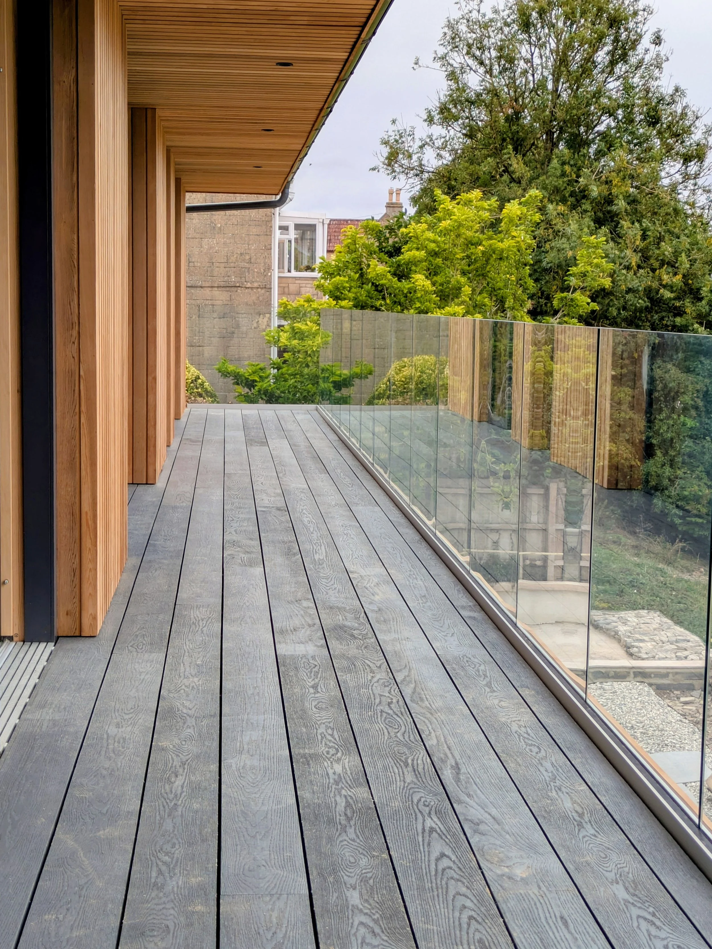 Oranssi technician working on a roof project