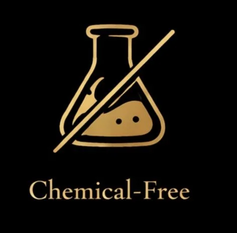 A logo with a stylized laboratory flask and a test tube crossed out, indicating chemical-free, with the words "Chemical-Free" below.