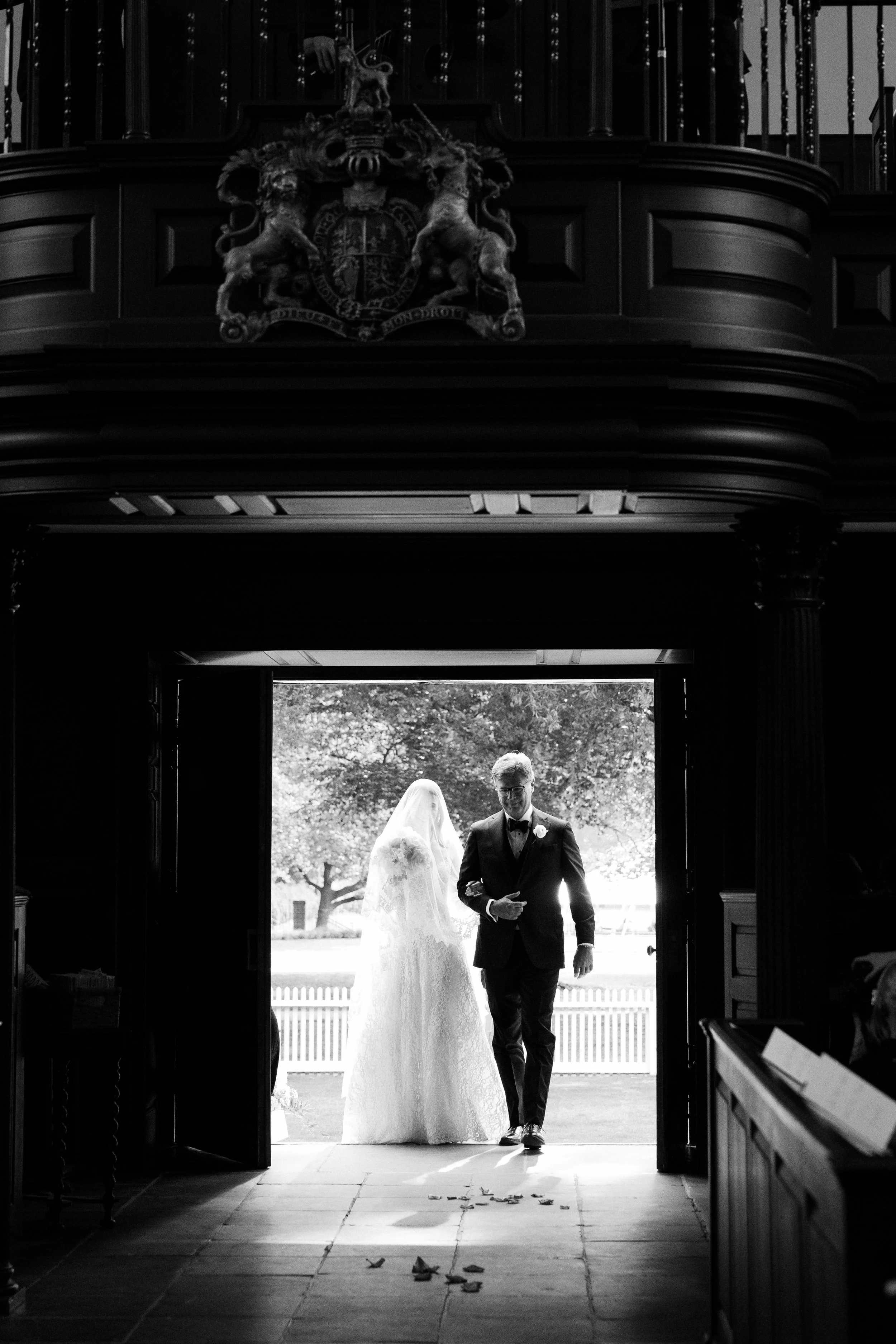 father and daughter walking down the aisle