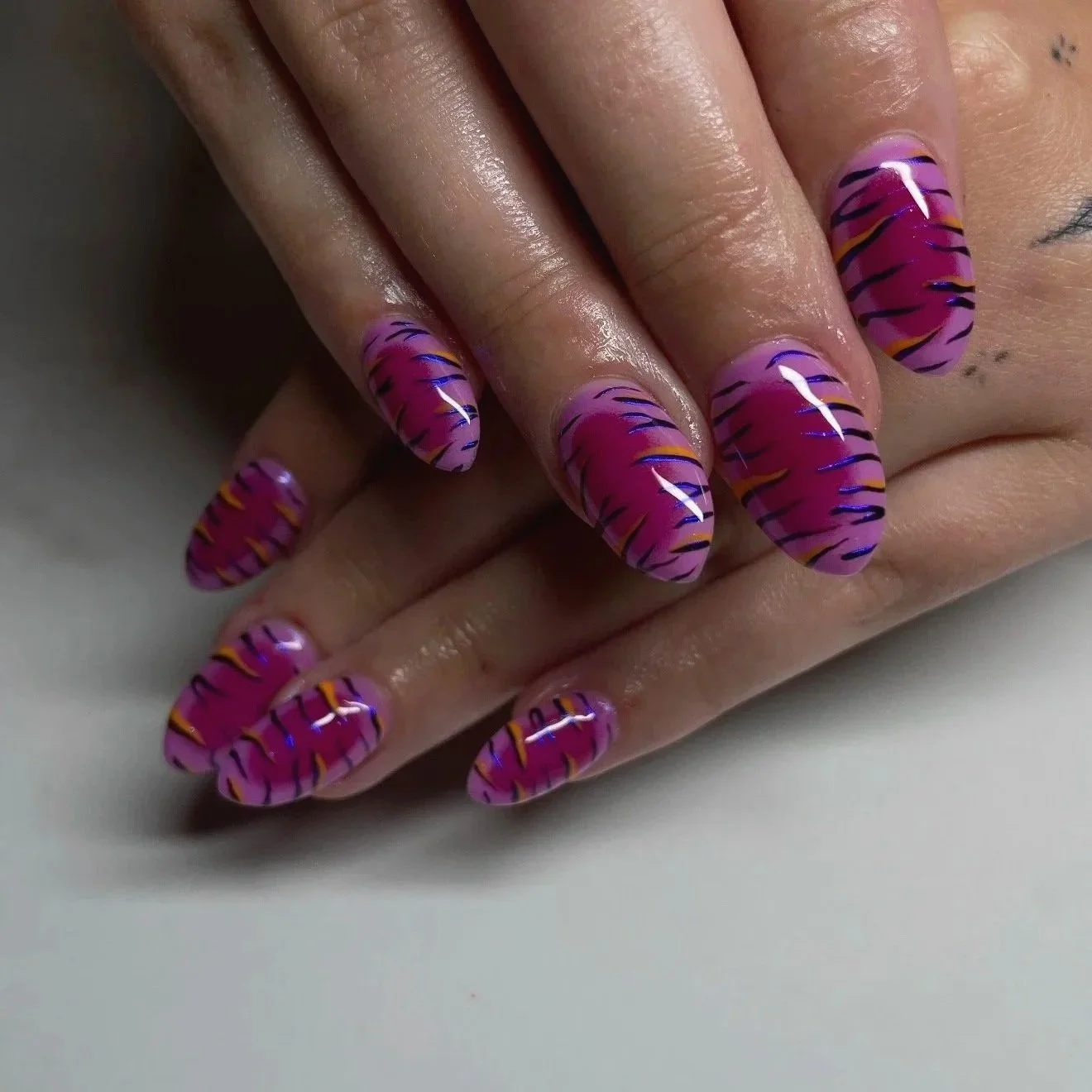 Purple and pink tiger stripe patterned nail art with Builder gel extensions by Salon 230 Daytona Beach