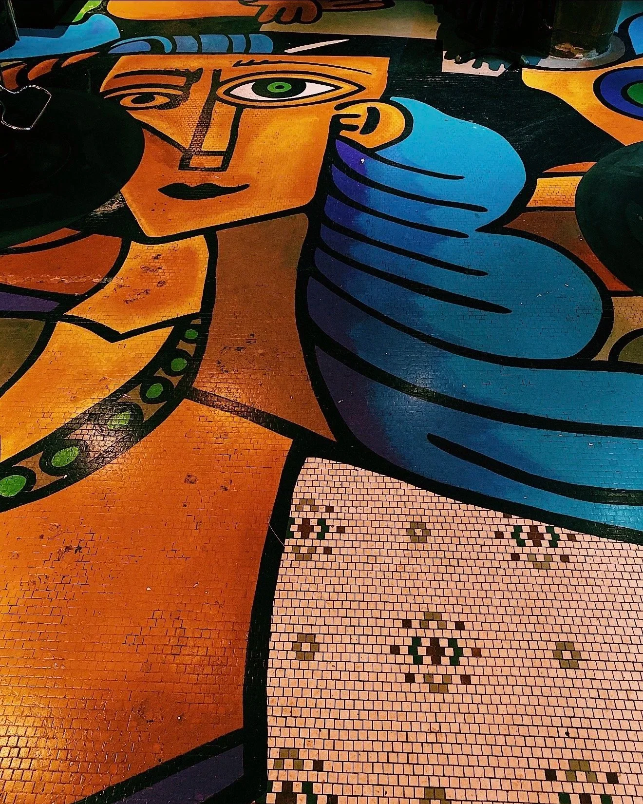Colorful  Picasso-like abstract style painted floor by Salon 230 Daytona Beach.