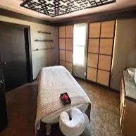 A massage table for massage services including relaxation massage, therapeutic massage, facials, body treatments, and waxing services. Spa above Salon 230