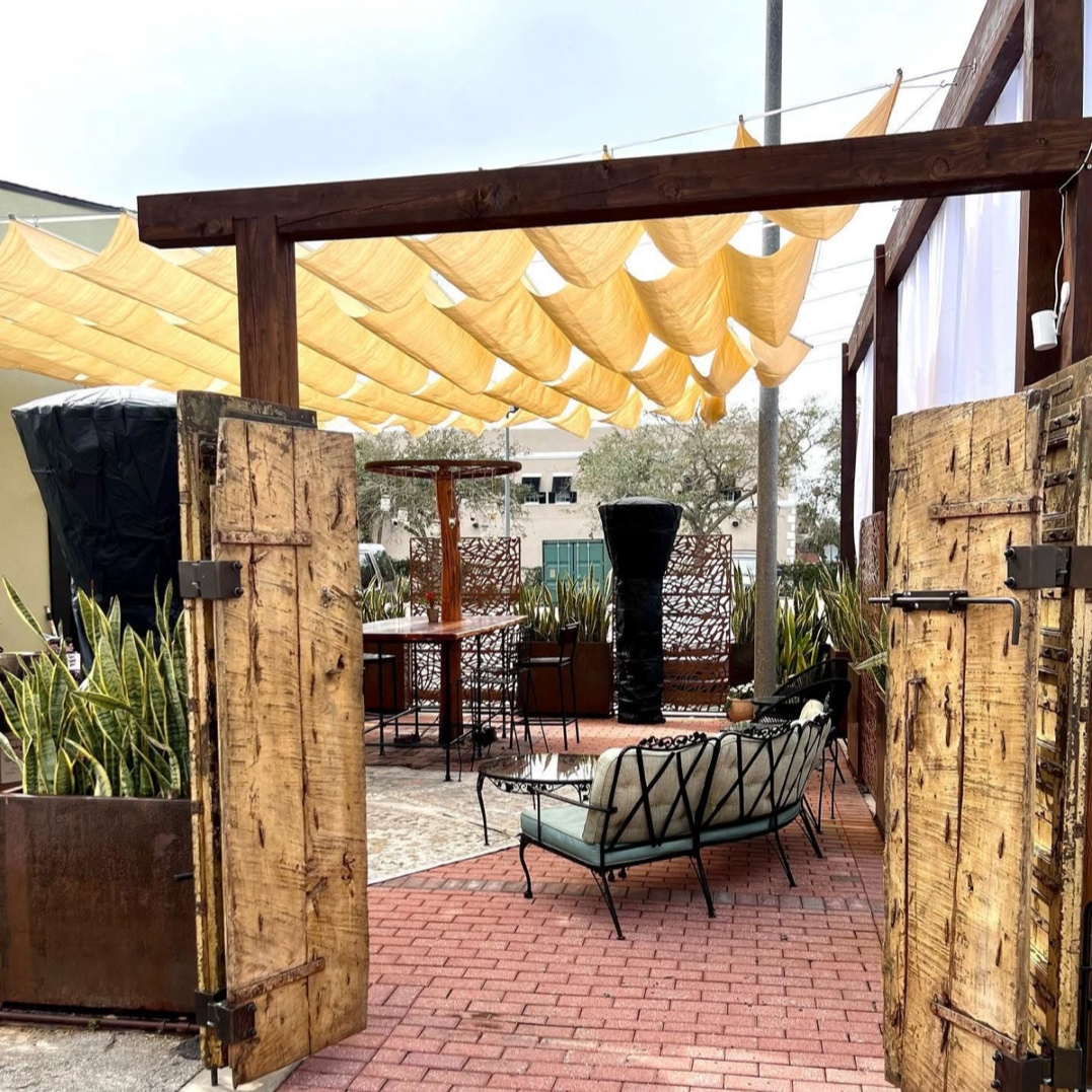 Cozy outdoor seating for ice cold beer and wine in Downtown Daytona Beach at Hatfield's Hideaway