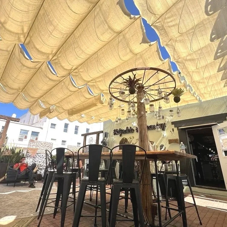 Outdoor patio serving beer and wine and specialty drinks with live music on weekends in Downtown Daytona Beach at Hatfield's Hideaway