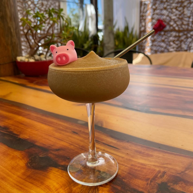 Frozen espresso martini adorned with our signature pig. Beer and wine bar Downtown Daytona Beach at Hatfield's Hideaway