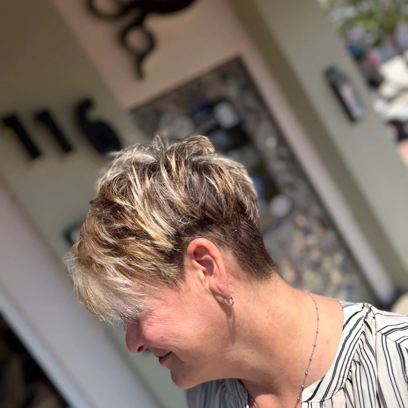 short modern haircut trendy highlights by Salon 230 Daytona Beach