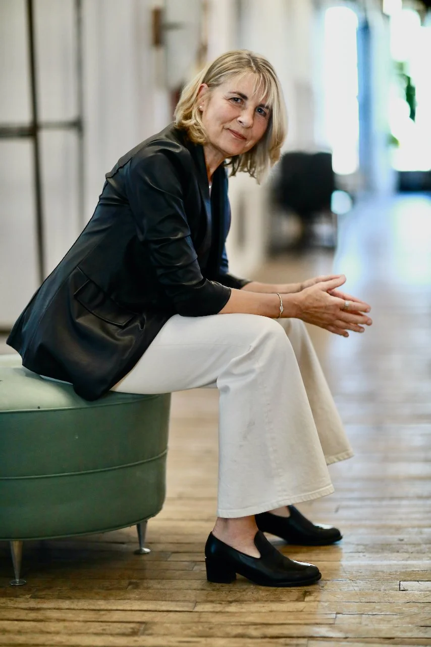 Client in reflective moment during psychotherapy session for clarity
