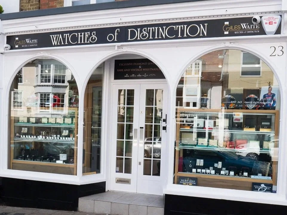 Watches of Distinction storefront showcasing luxury timepieces.
