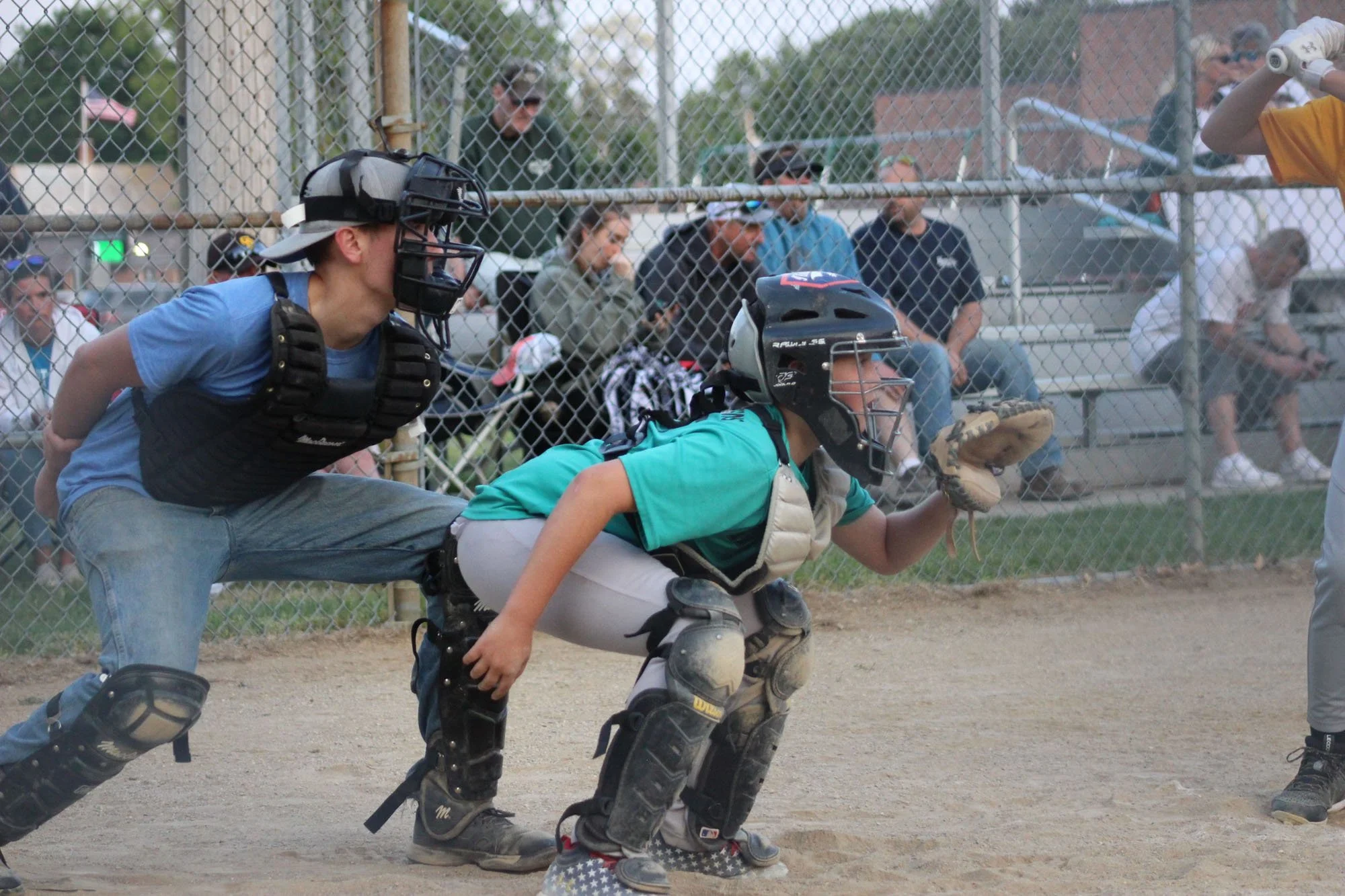 Catcher and umpire in a youth baseball game