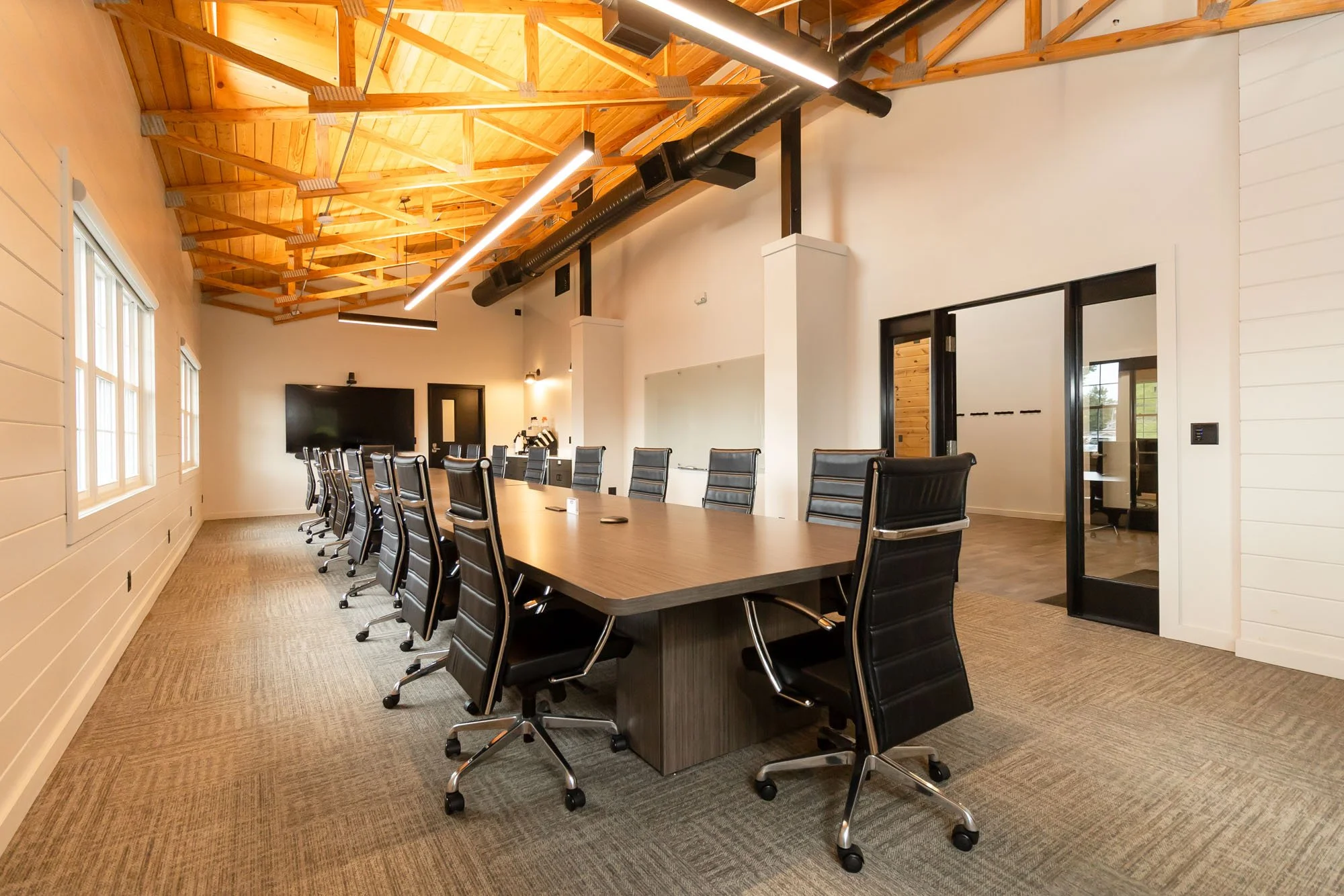 Photo of Board Room meeting space, wam, large room with large desk in the center