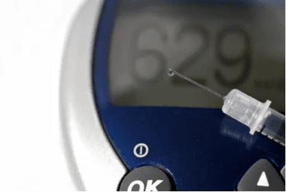 Needle in front of device reading "629"