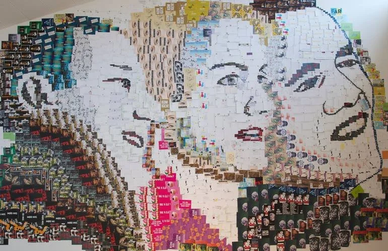A mosaic portrait of Marilyn Monroe created from small photographs and magazine clippings.
