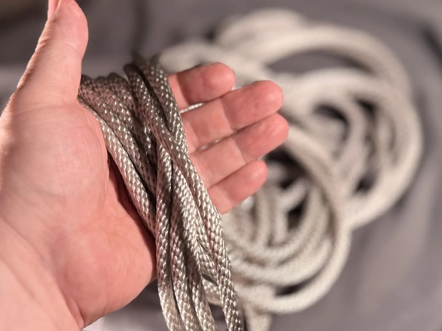 Silver Shibari rope.