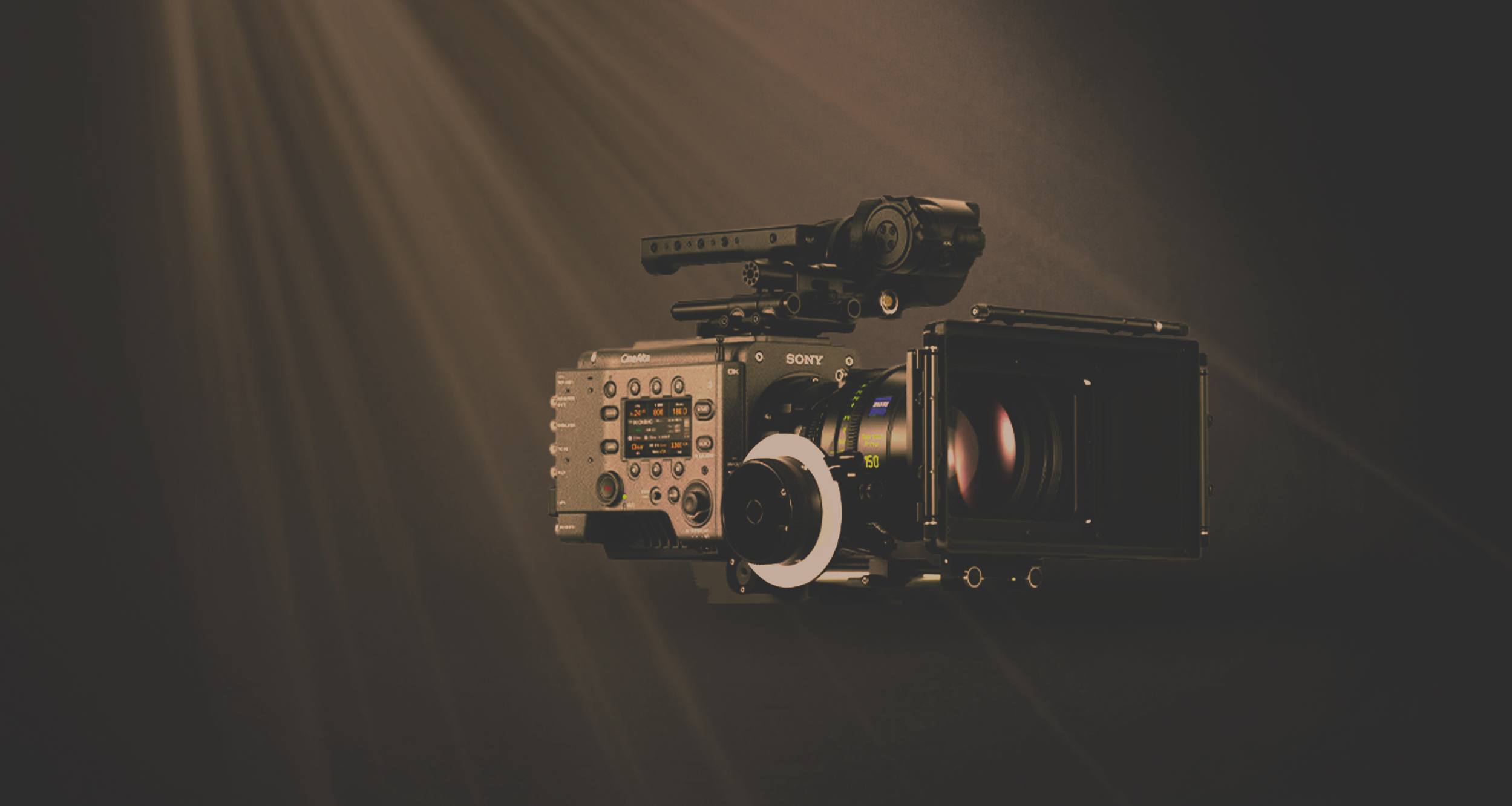 A Sony Venice 2 camera on a rig in front of a smoky studio backdrop